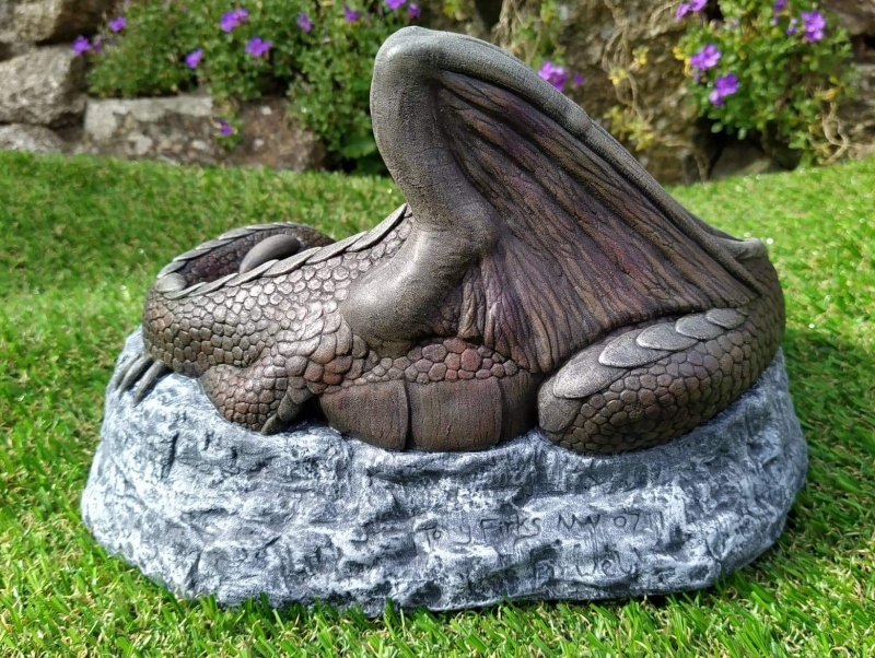 Sleeping dragon garden ornament back view